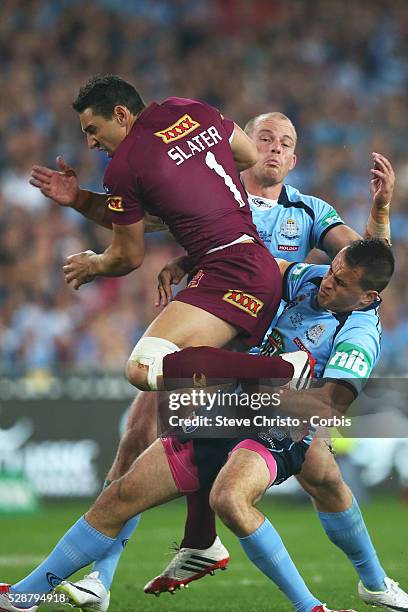 Maroons Billy Slater is tackled by Blues Josh Reynolds and Beau Scott after taking a bomb at ANZ stadium. Sydney, Australia. Wednesday 18th June 2014.