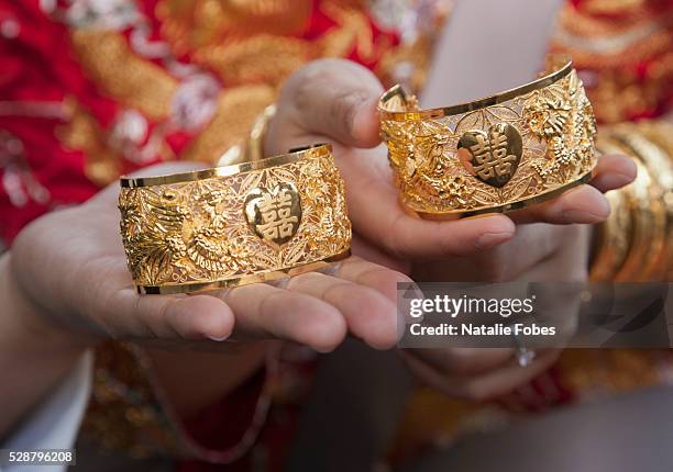 solid gold wedding bracelets with chinese character for luck - wedding jewellery stock pictures, royalty-free photos & images