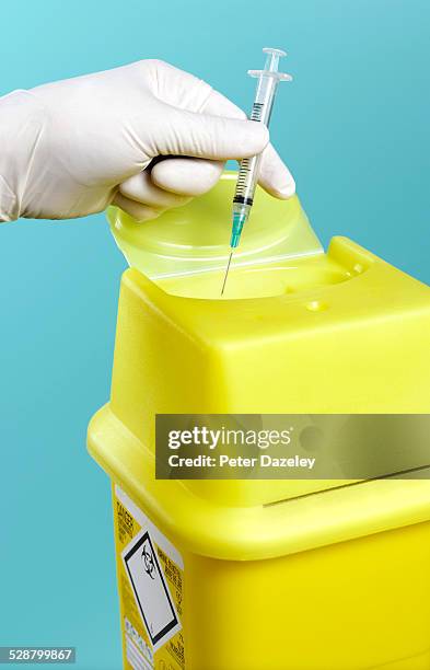 sharps disposal bin for used syringe - hospital safety stock pictures, royalty-free photos & images