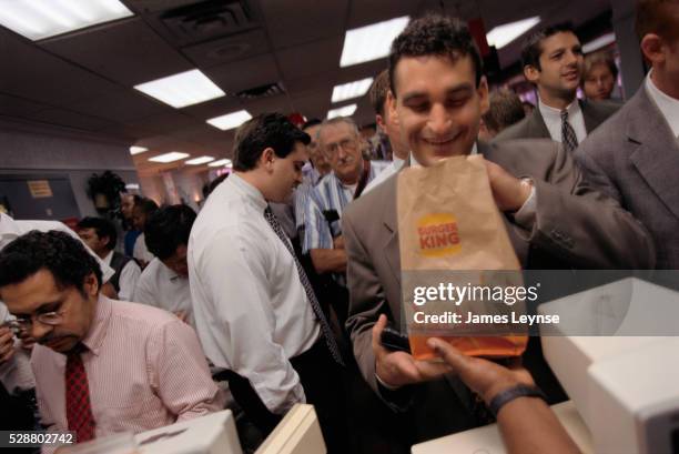 businessman receiving his burger king lunch order - the burger king stock pictures, royalty-free photos & images