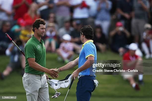 Australia's Adam Scott and Northern Ireland's Rory McIlroy shake hands after finishing their round on the third day at the Royal Australian Golf...