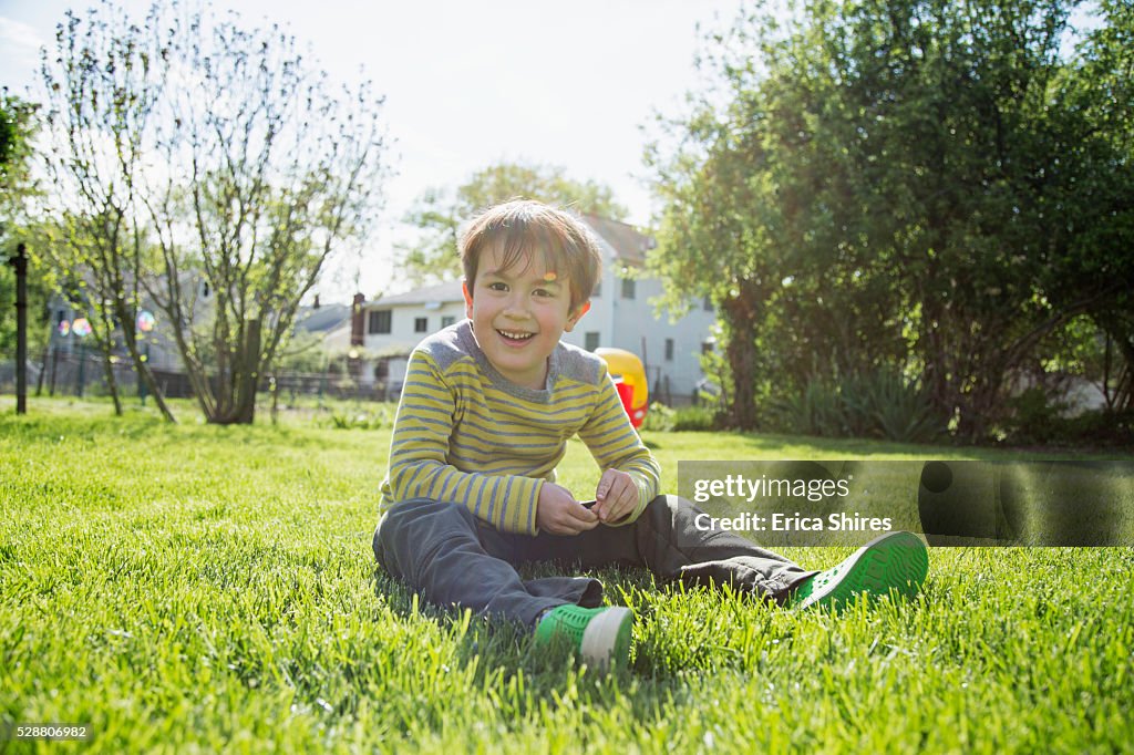 Portrait of boy (6-7) in backyard