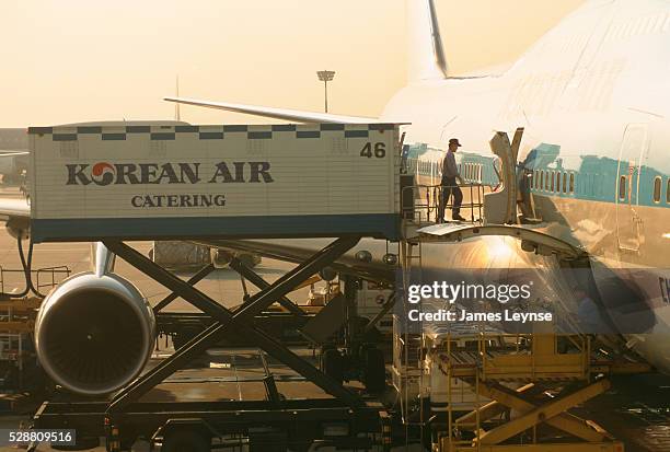 In-flight meals from Korean Air catering are loaded onto a 747 at Seoul Kimpo International Airport.