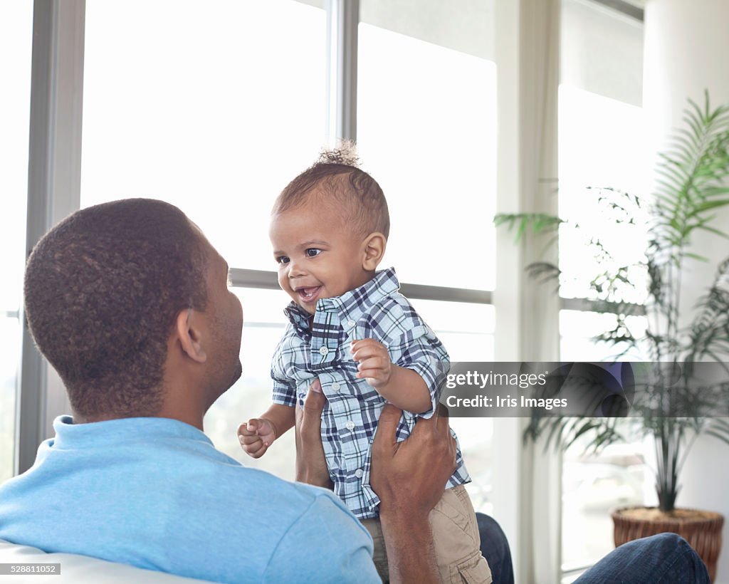 Father and son (6-12 months) at home