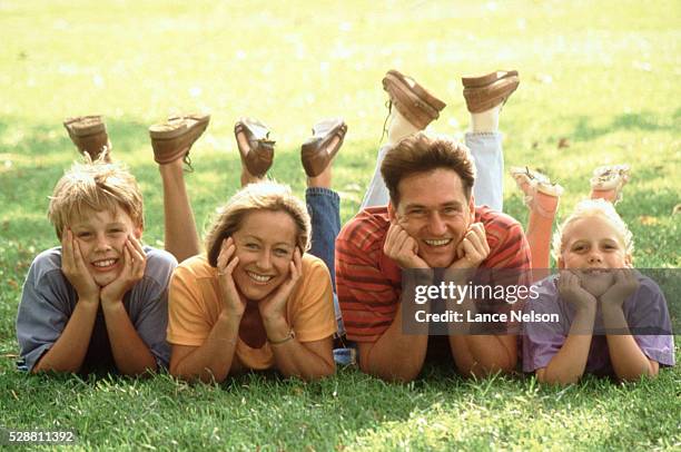 family smiling - male feet on face stock pictures, royalty-free photos & images