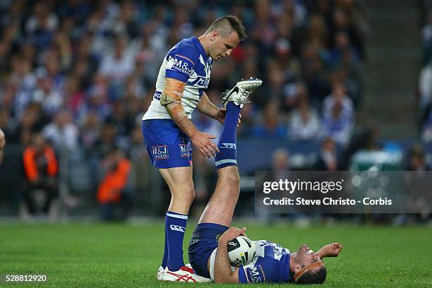 Bulldogs Dale Finucane gets attention from teammate Josh Reynolds against the Panthers during the Preliminary Final at ANZ Stadium. Sydney,...