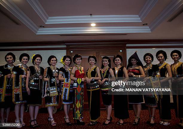 Malaysian women from the indigenous Kadazandusun community of Sabah pose before taking part in the annual "Unduk Ngadau Kaamatan", a cultural beauty...