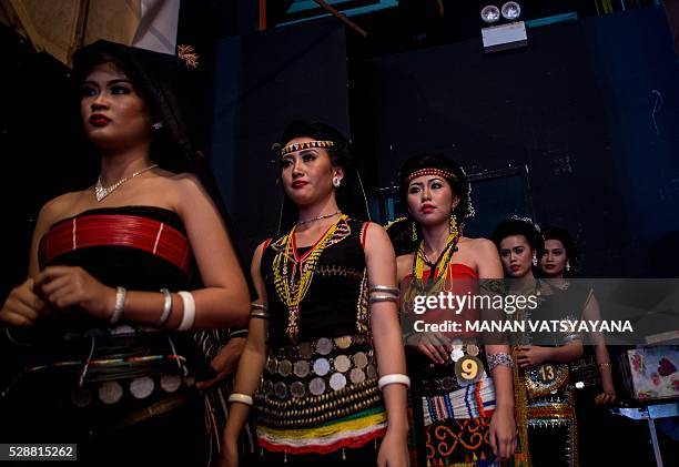 Malaysian women from the indigenous Kadazandusun community of Sabah wait backstage during the annual "Unduk Ngadau Kaamatan", a cultural beauty...