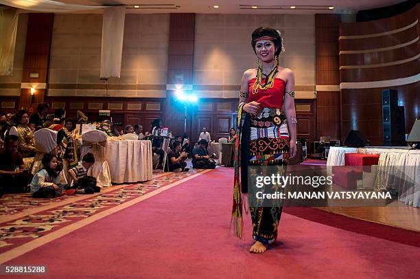 Malaysian woman from the indigenous Kadazandusun community of Sabah walks infront of the judges during the annual "Unduk Ngadau Kaamatan", a cultural...