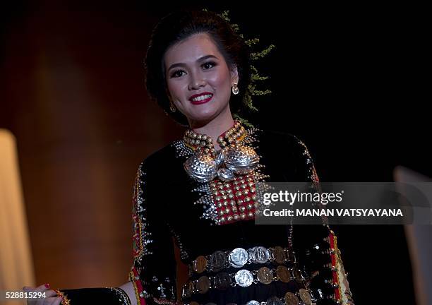 Malaysian woman from the indigenous Kadazandusun community of Sabah walks on the stage during the annual "Unduk Ngadau Kaamatan", a cultural beauty...