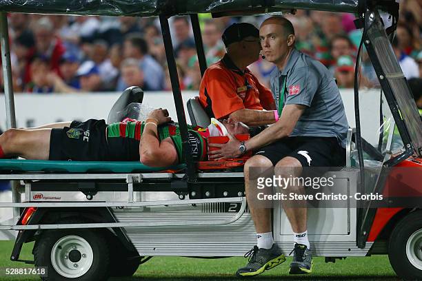 Rabbitohs Dave Tyrrell is stretchered from the field after a tackle from Bulldogs captain James Graham during the NRL Grand Final match at ANZ...