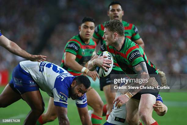 Rabbitohs Chris McQueen is tackled by Bulldogs Aiden Tolman during the NRL Grand Final match at ANZ Stadium 2014. Sydney, Australia. Sunday 5th...