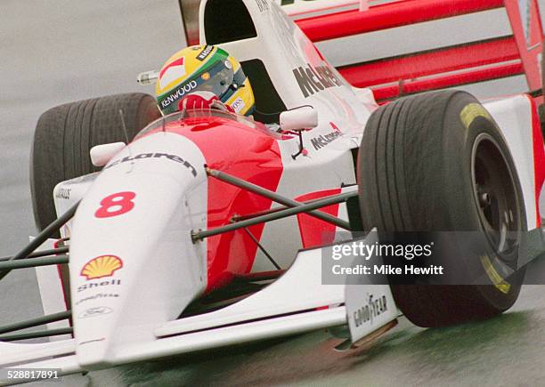 Ayrton Senna of Brazil drives the Marlboro McLaren MP4-8 Ford HB V8 in the rain during the Sega European Grand Prix on 11th April 1993 at the...