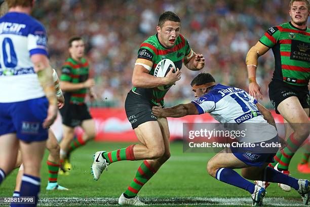 Rabbitohs Sam Burgess heads for the try line through some paper thin defence from Bulldogs Dale Finucane during the NRL Grand Final match at ANZ...