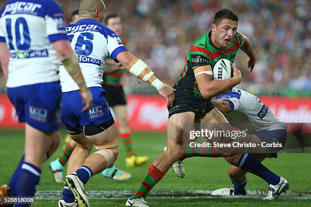 Rabbitohs Sam Burgess heads for the try line through some paper thin defence from Bulldogs Dale Finucane during the NRL Grand Final match at ANZ...