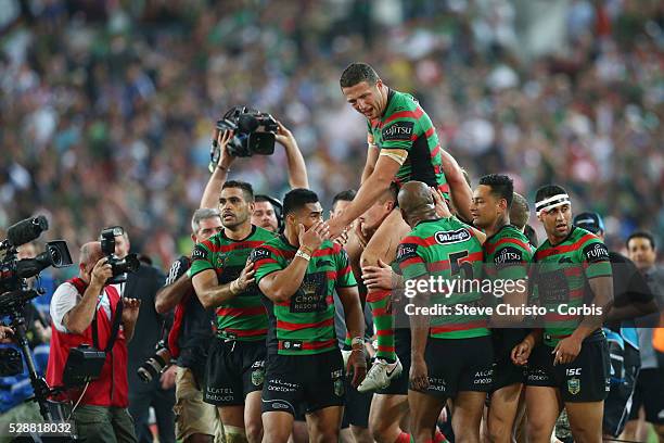 Rabbitohs Sam Burgess is lifted on team-mates shoulders after the NRL Grand Final match against the Bulldogs at ANZ Stadium 2014. Sydney, Australia....