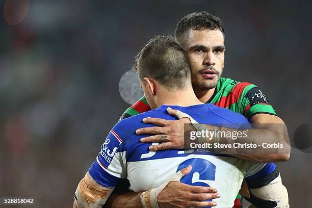 Rabbitohs Greg Inglis hugs Bulldogs Josh Reynolds after the NRL Grand Final match at ANZ Stadium 2014. Sydney, Australia. Sunday 5th October 2014.