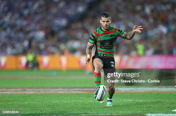 Rabbitohs Adam Reynolds kicks ahead during the NRL Grand Final match against the Bulldogs at ANZ Stadium 2014. Sydney, Australia. Sunday 5th October...