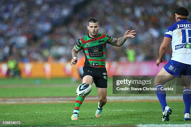 Rabbitohs Adam Reynolds kicks ahead during the NRL Grand Final match against the Bulldogs at ANZ Stadium 2014. Sydney, Australia. Sunday 5th October...