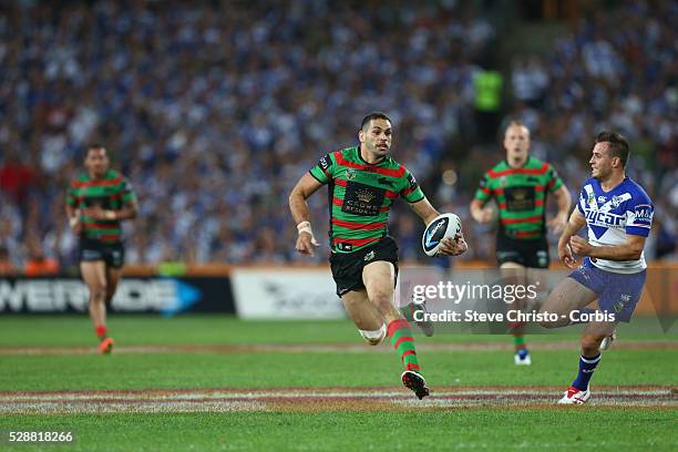 Rabbitohs Greg Inglis side steps passed Bulldogs Josh Reynolds during the NRL Grand Final match at ANZ Stadium 2014. Sydney, Australia. Sunday 5th...