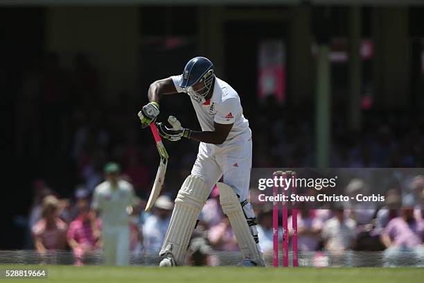 England's Michael Carberry has his bat broken from a Ryan Harris delivery at the Sydney Cricket Ground. Sydney, Australia. Sunday 5th January 2014.