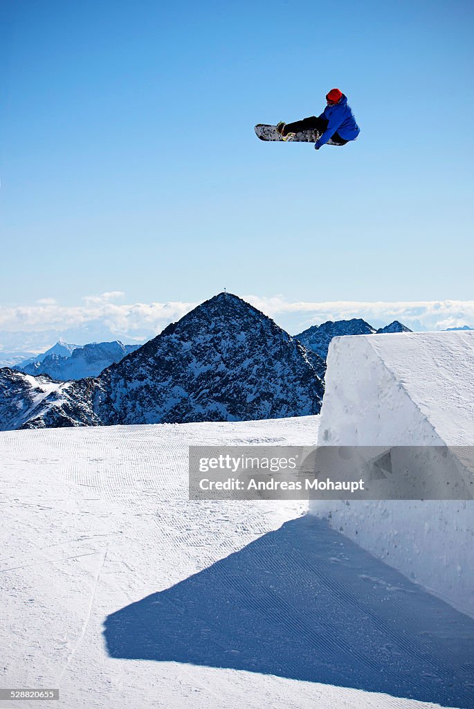 A professional snowboarder performing a trick