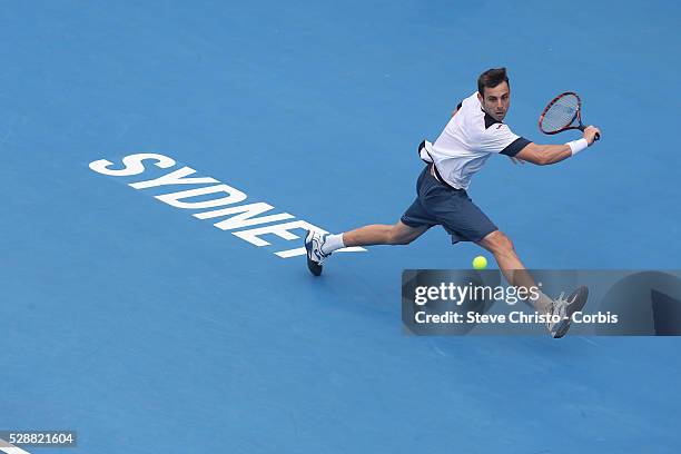 Marcel Granollers of Spain hits a backhand against Australia's Bernard Tomic on centre court. Sydney, Australia. Tuesday 7th January 2014.