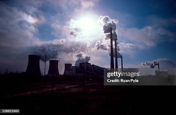 Coal-fired power plant spews smoke into the air in Daqi, Inner Mongolia, China. Baotou is an excellent example of a one-industry town, and that...