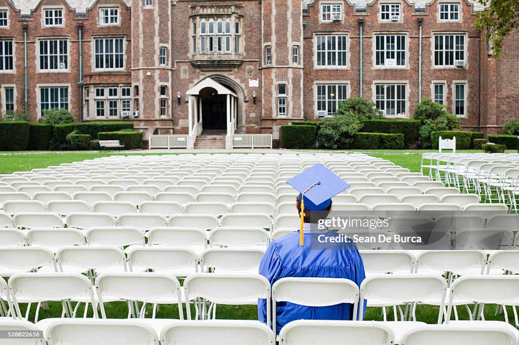 Graduate sitting alone