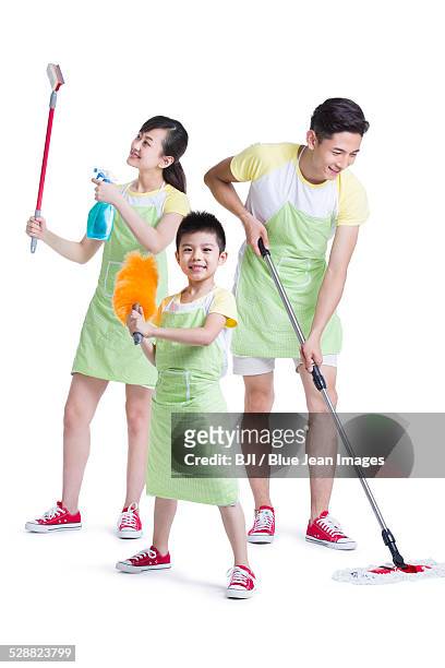 happy young family with cleaning supplies - apron isolated stock pictures, royalty-free photos & images