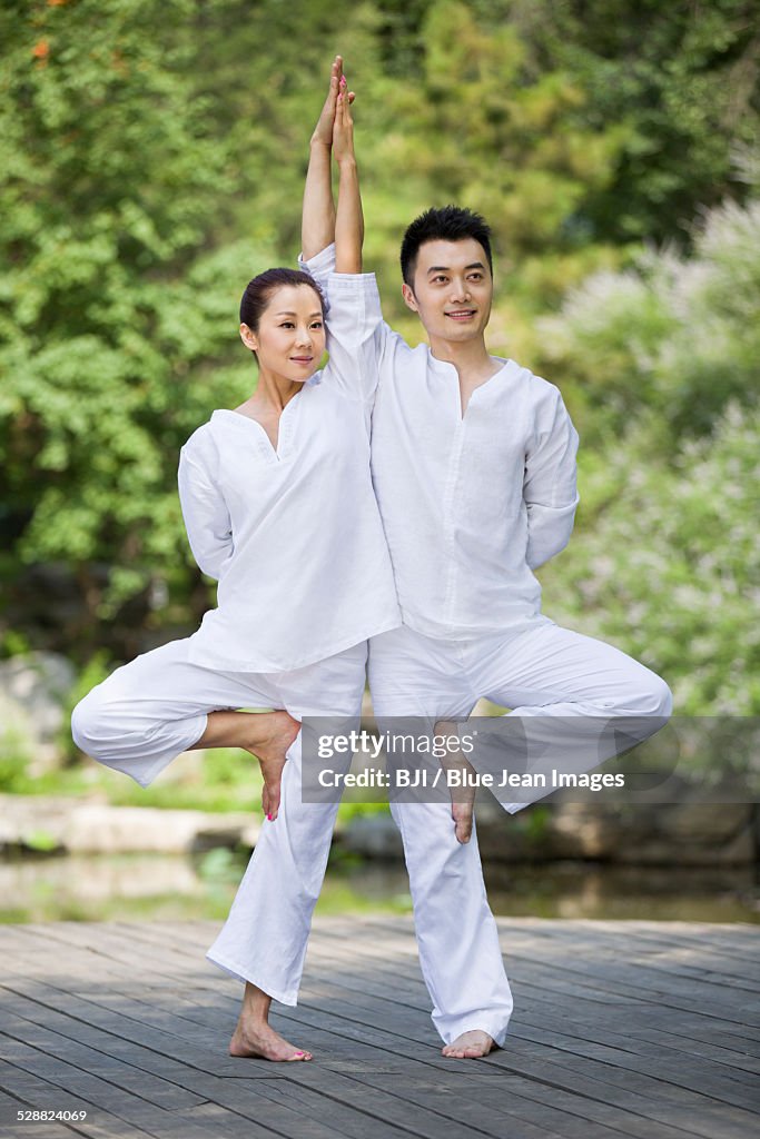 Young adult practicing yoga