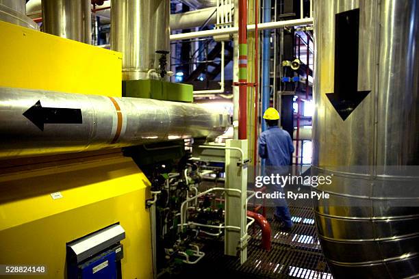 Worker walks through the main turbine room at the LingAo nuclear power plant in Daya Bay, Guangdong province, China. The LingAo nuclear power plant...