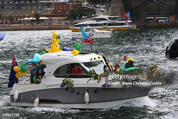 Australia Day celebrations on Sydney Harbour foreshore. Procession of boats pass under the Sydney Harbour Bridge. Sydney Australia. Sunday 26th...