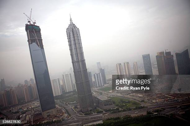 The almost finished Shanghai World Financial Center stands next to the Jin Mao Tower in Pudong, Shanghai.