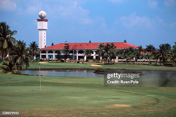 Green, with the club house in the background, at the Taida Golf Course just outside Haikou city, the capital of Hainan province in China. Taida Golf...