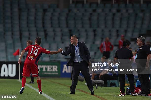 Adelaide's coach Josep Gambau congratulates Cameron Watson during the match against Sydney at Allianz Stadium. Sydney Australia. Saturday 8th...