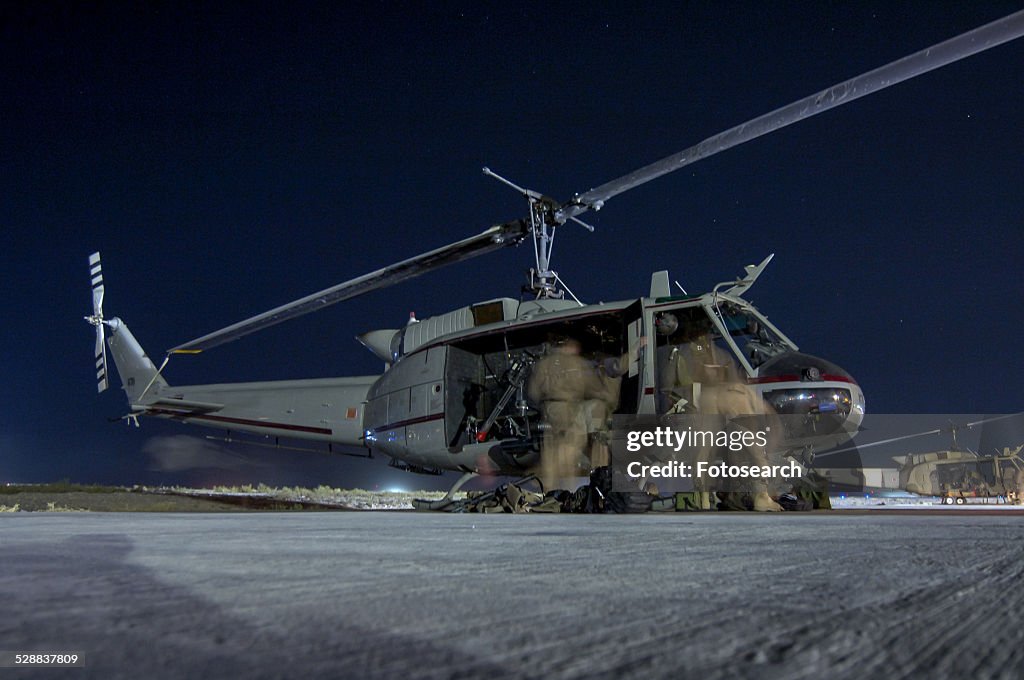 Military helicopter preparing for night-time mission from Kandahar, Afghanistan