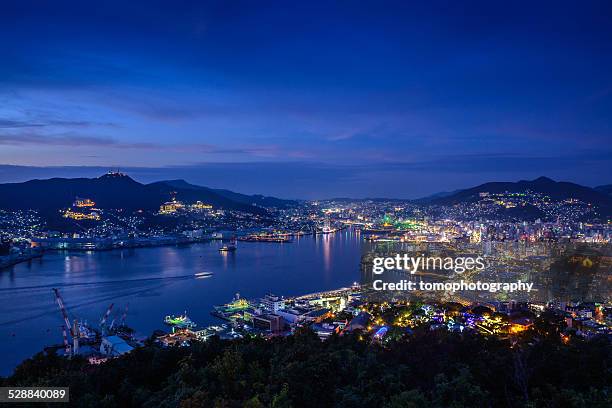 nightshot of nagasaki bay in japan - nagasaki prefecture stock pictures, royalty-free photos & images