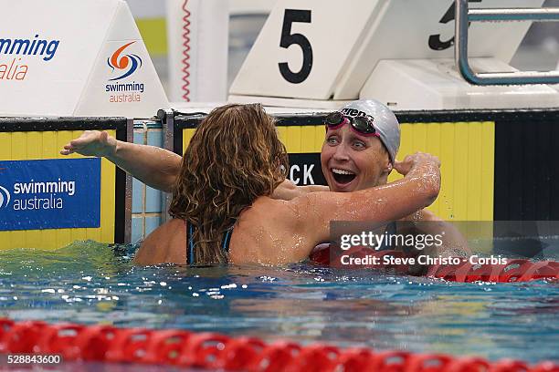 Sally Hunter hugs winner Jennie Johansson of Sweden after the Women's 50m Breaststroke final during the Hancock Prospecting Australian Swimming...
