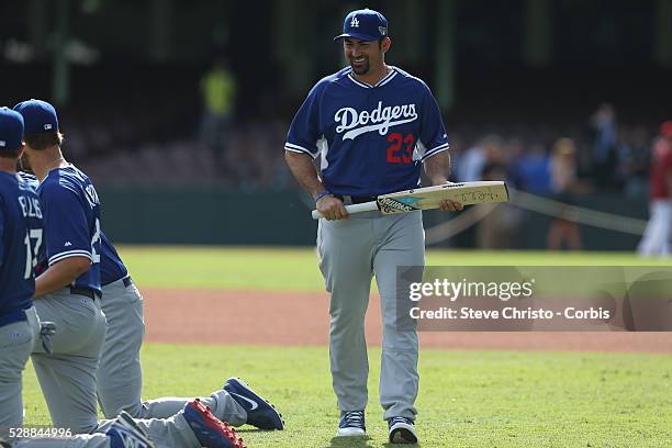 Dodgers Adrian Gonzalez holds a cricket bat signed by Australian captain Michael Clarke training at the Sydney Cricket Ground. Sydney, Australia....