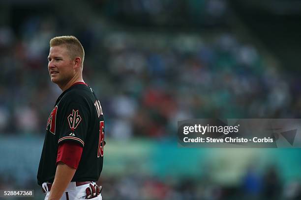 Arizona Diamondbacks Mark Trumbo talks to first base coach Dave Mackay during the match against the Los Angeles Dodgers at the Sydney Cricket Ground....