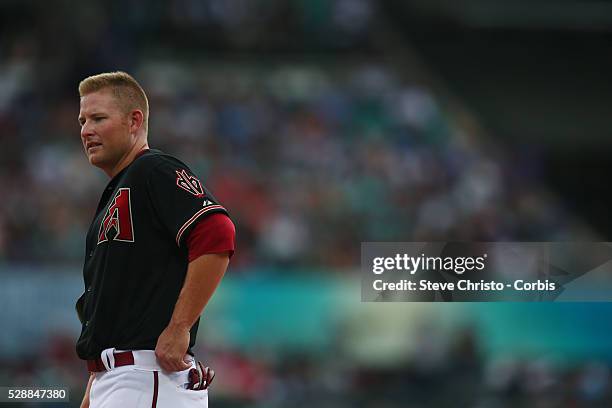 Arizona Diamondbacks Mark Trumbo talks to first base coach Dave Mackay during the match against the Los Angeles Dodgers at the Sydney Cricket Ground....