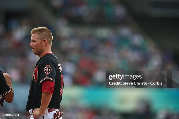 Arizona Diamondbacks Mark Trumbo talks to first base coach Dave Mackay during the match against the Los Angeles Dodgers at the Sydney Cricket Ground....