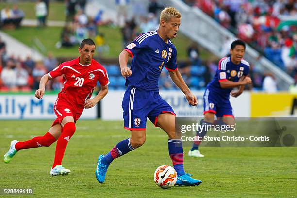 Japan's Keisuke Honda in action against Palestine at Newcastle Stadium. Sydney Australia. Monday, 12th January 2015 .