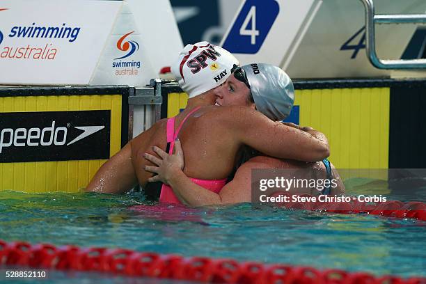 Women's 50m Backstroke final winner Emily Seebohm is congratulated by Megan Nayafter the race at the Brisbane Aquatic Centre. Brisbane, Australia....