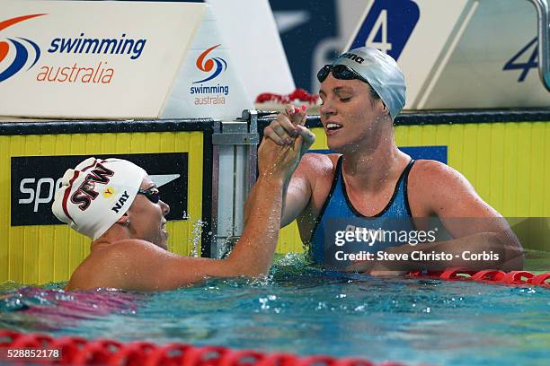 Women's 50m Backstroke final winner Emily Seebohm is congratulated by Megan Nayafter the race at the Brisbane Aquatic Centre. Brisbane, Australia....