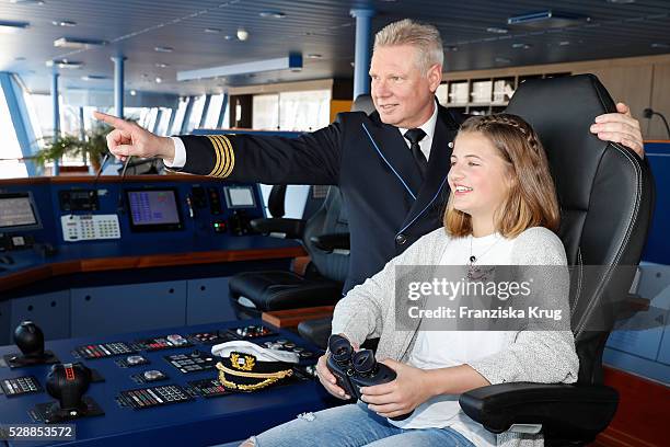 Captain Detlef Harms and child actress and godmother Emma Tiger Schweiger during the AIDAprima Cruise Ship Baptism on May 7, 2016 in Hamburg, Germany