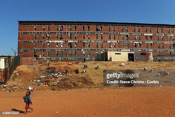 Locals play a morning game of soccer on a dirt pitch in Alexandra Township in Johannesburg, South Africa, during the 2010 World Cup.