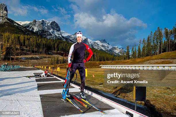 portrait of biathlon athlete at mtn firing range - biathlon ski stock pictures, royalty-free photos & images