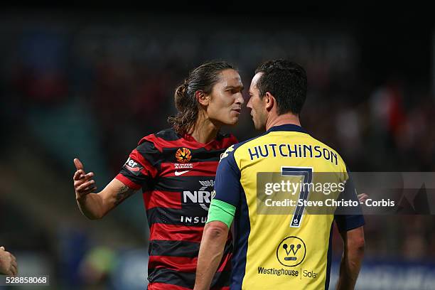 Wanderers Jerome Polenz and Mariners captain John Hutchinson have words during the match at Parramatta Stadium. Sydney, Australia. Saturday 26th...